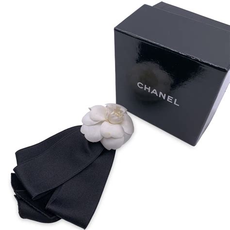 chanel camellia brooch ribbon|chanel pearl brooch price.